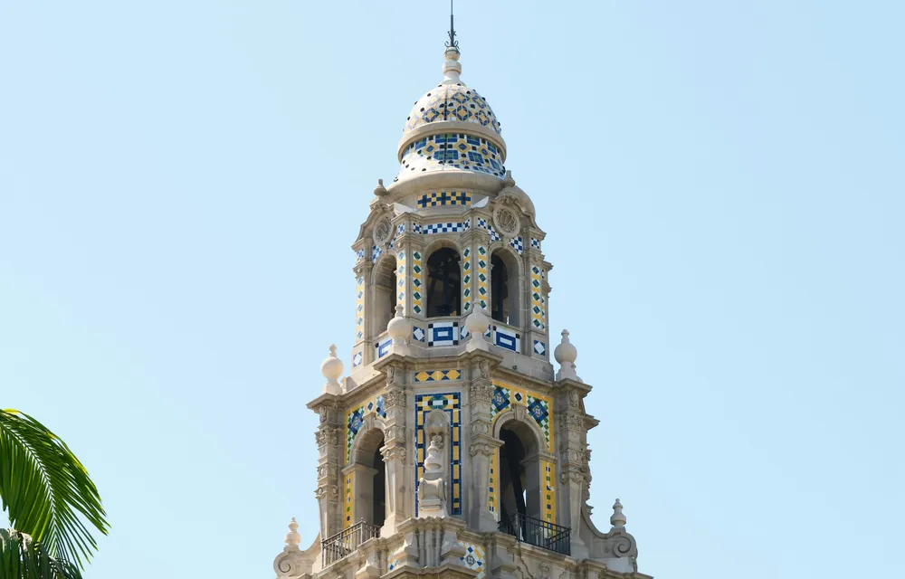 The ornate California Tower in Balboa Park framed by palm trees