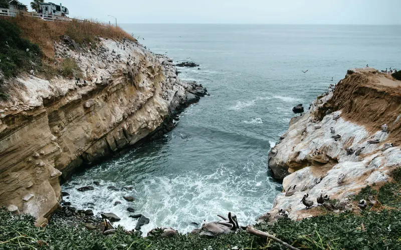Sandstone cliffs and surf along the San Diego coastline